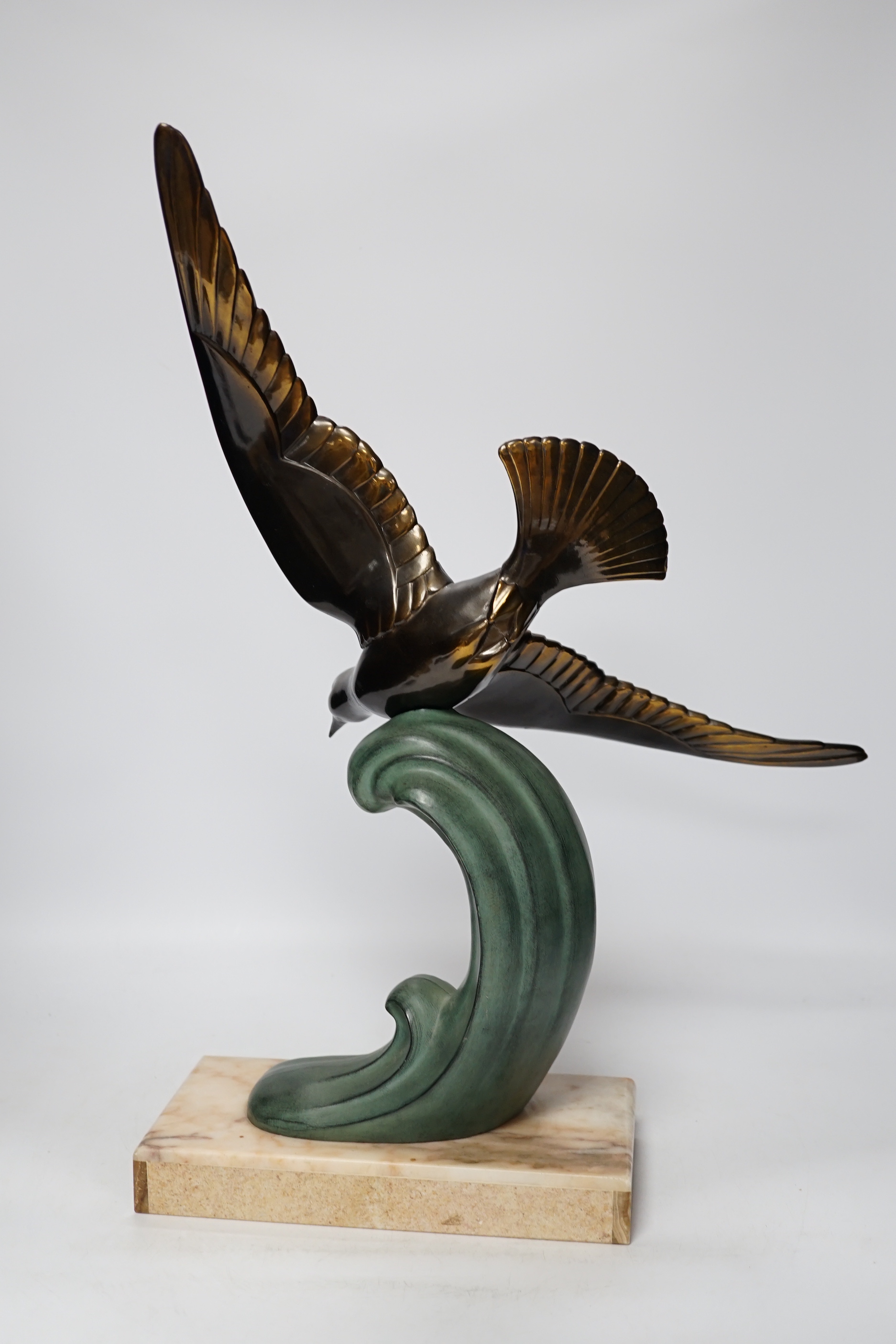 A French Art Deco bronzed and patinated metal Seagull on marble base, 51cm high